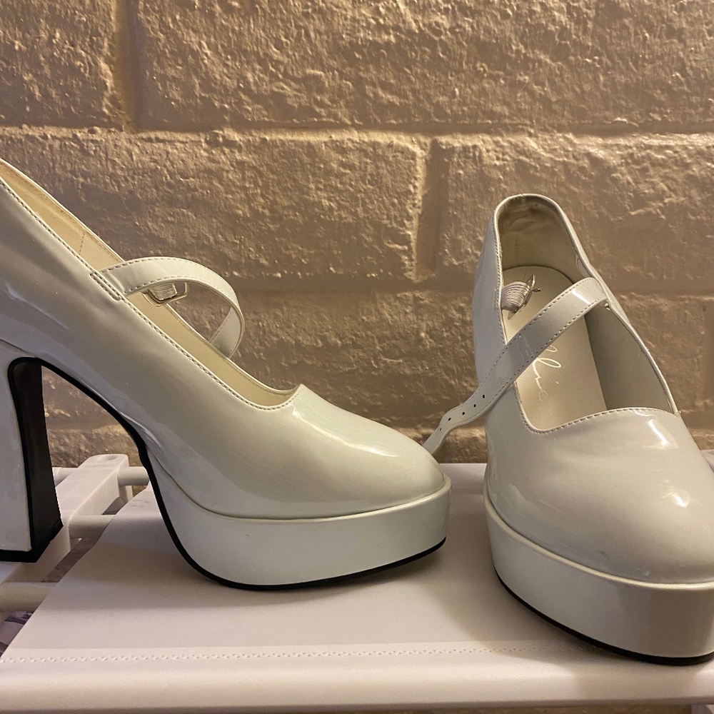 Heavenly vamp tramp white heels